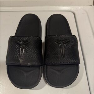 Black Slide Sandals with Embossed Design KOBE